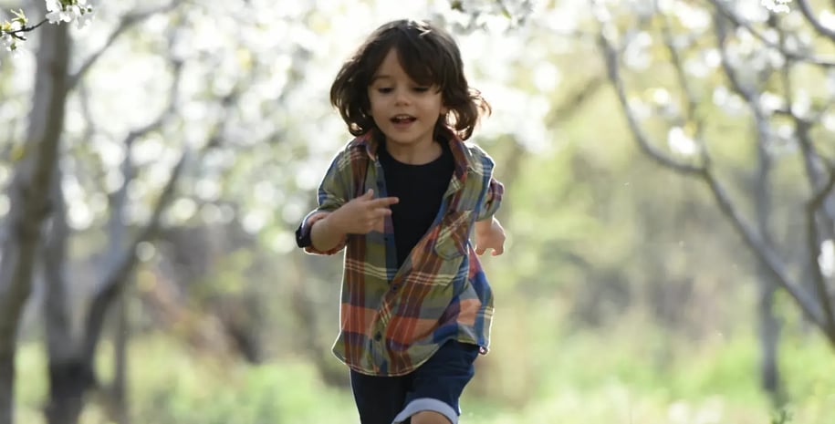 Child running in a park